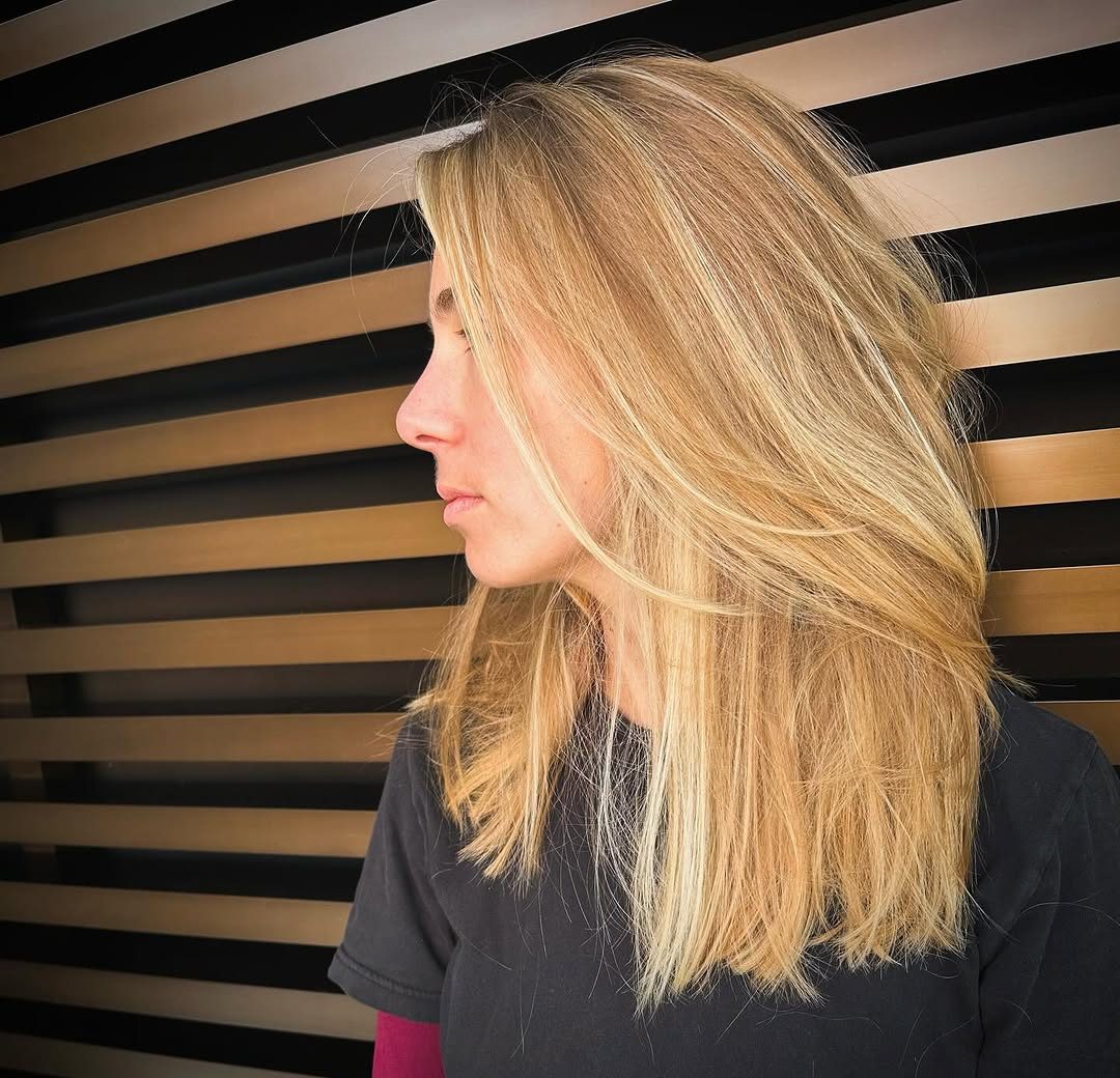 Beachy textured blonde with lived-in color, side profile
