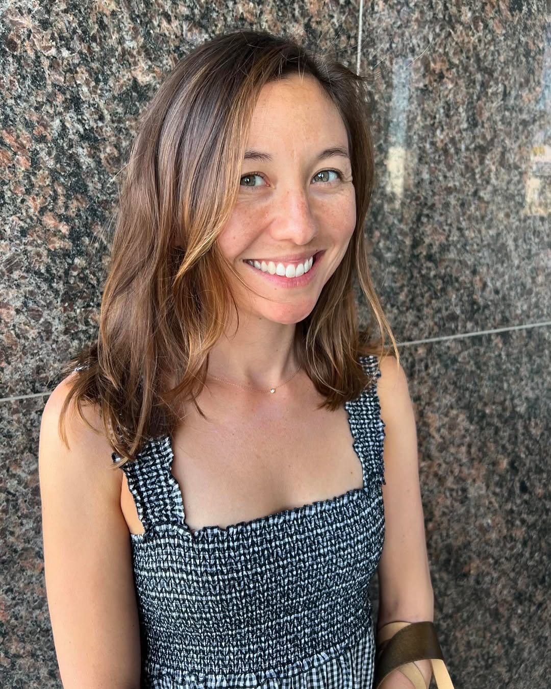 Long sun-kissed balayage, smiling client