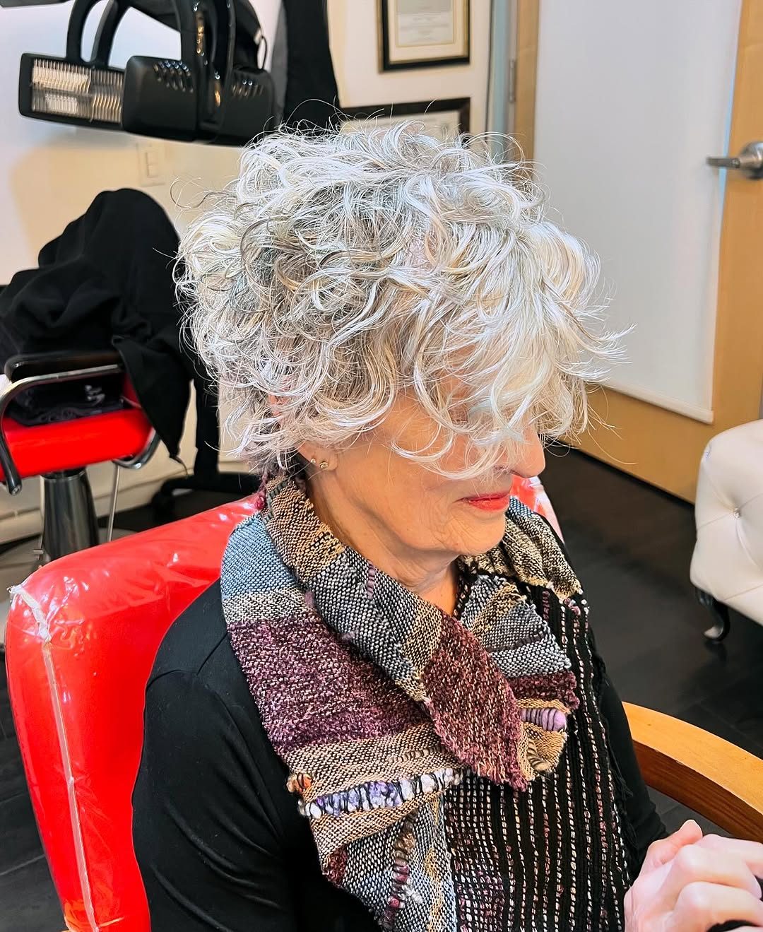 Natural silver curls with a shaped curl cut